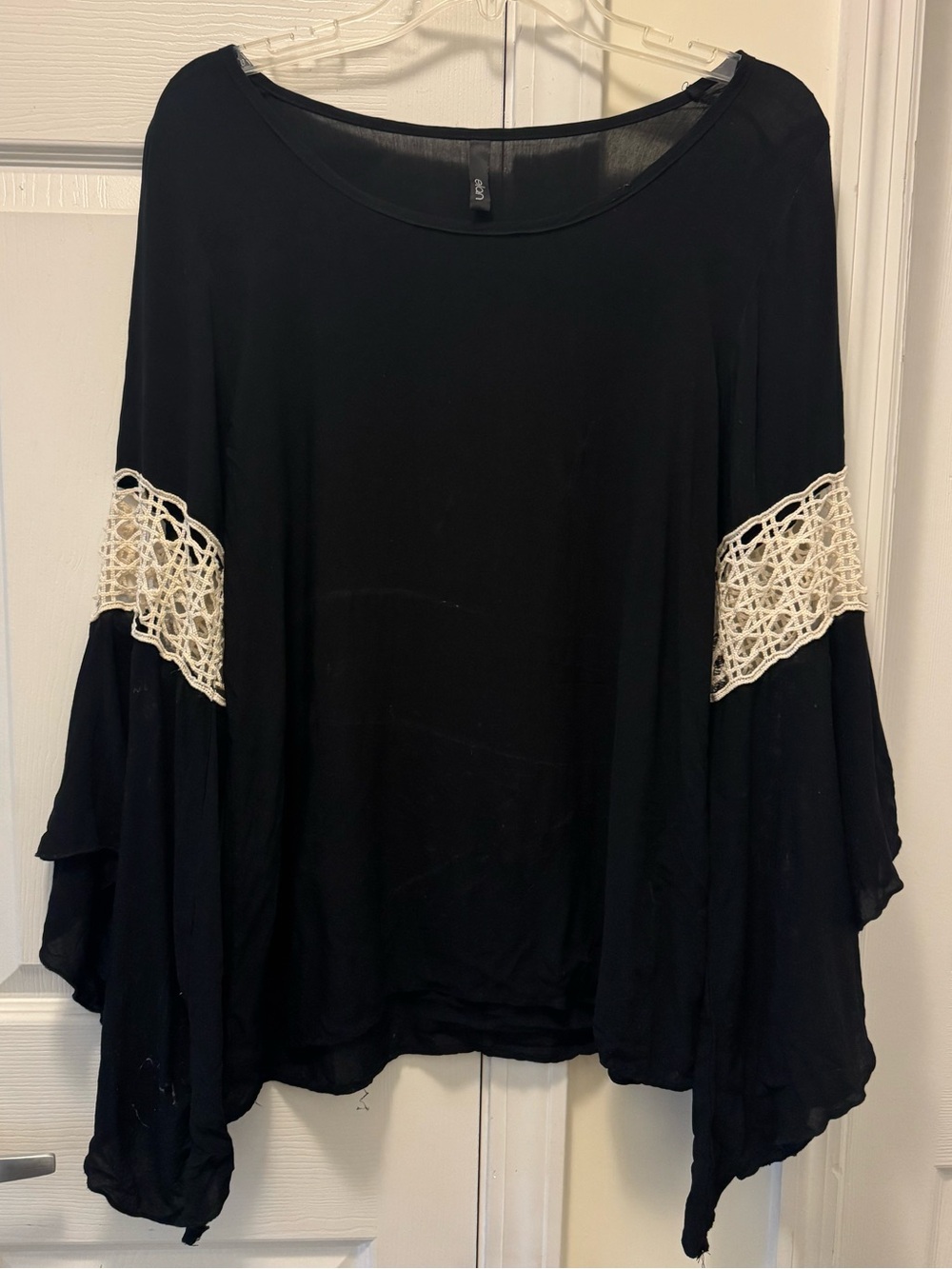 Black Large women’s top with bell sleeves and crochet detail